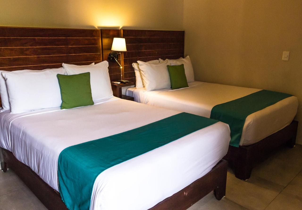 Aquastar Hotel & Apartments Mahahual Bagian luar foto