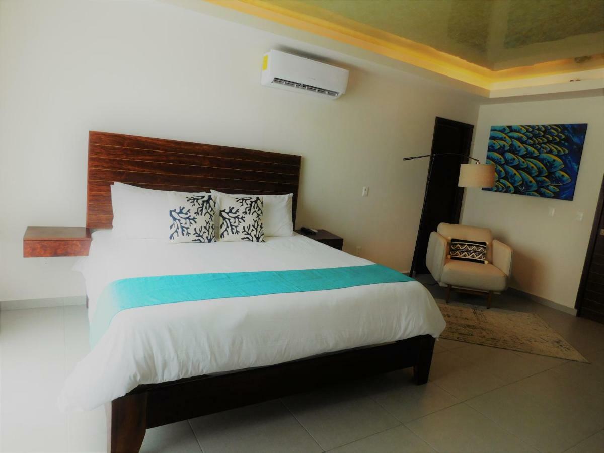 Aquastar Hotel & Apartments Mahahual Bagian luar foto