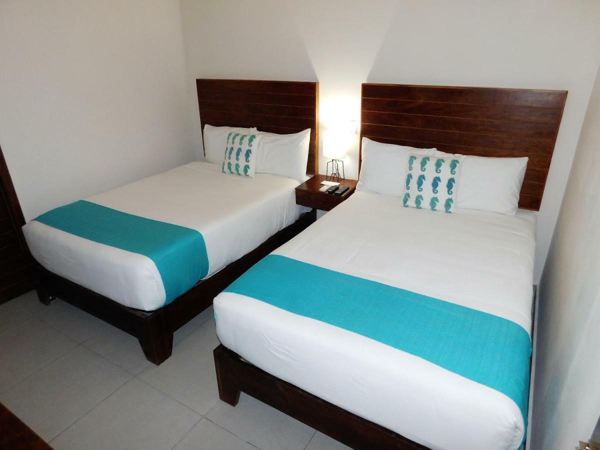 Aquastar Hotel & Apartments Mahahual Bagian luar foto